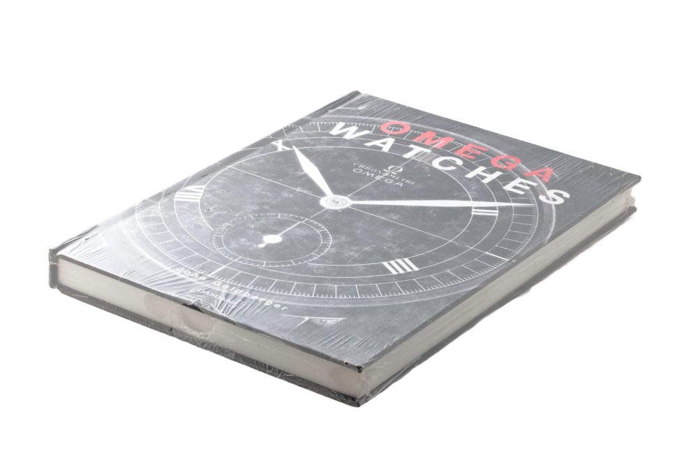 Lot #14844 – Omega Watches Book By John Goldberger Sealed Collector's Bookshelf John Goldberger